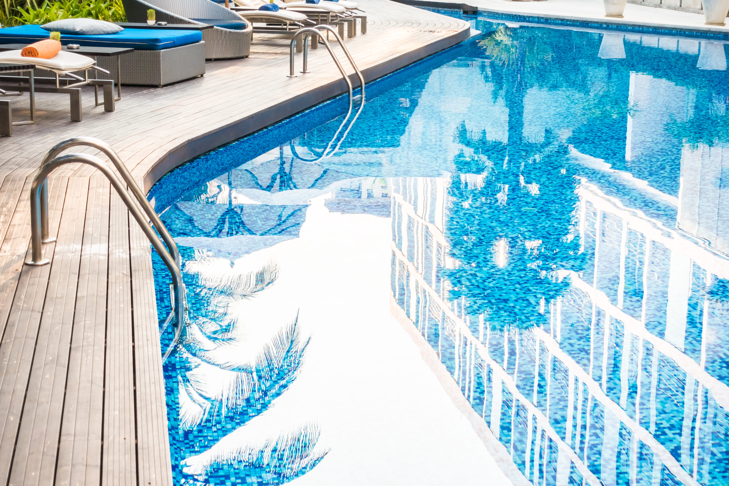 Tanning ledge and attached spa added to an existing pool during a structural remodel in Georgia by Aqualis Pools