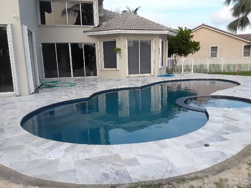 Freeform pool with a paver deck